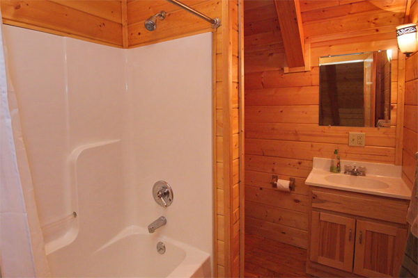 Refreshing shower or bath experience in the log cabin bathroom
