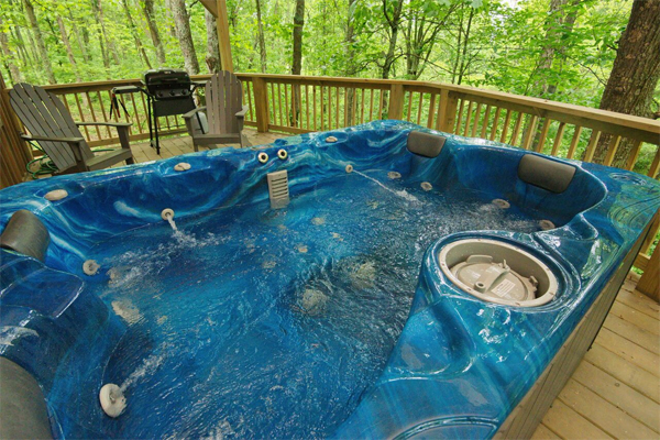 hot tub on deck with seating